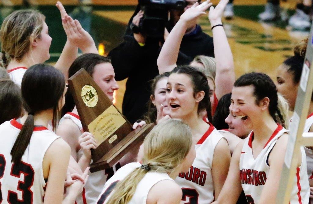 The Winnsboro Lady Raiders celebrate Saturday after winning the regional basketball tournament to qualify for the state tournament this week in San Antonio. (Monitor photo by John Arbter)